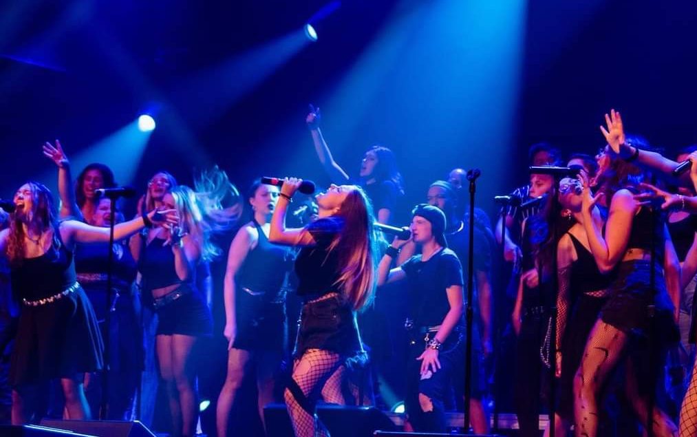 The RockNRoll Chorus performing on stage